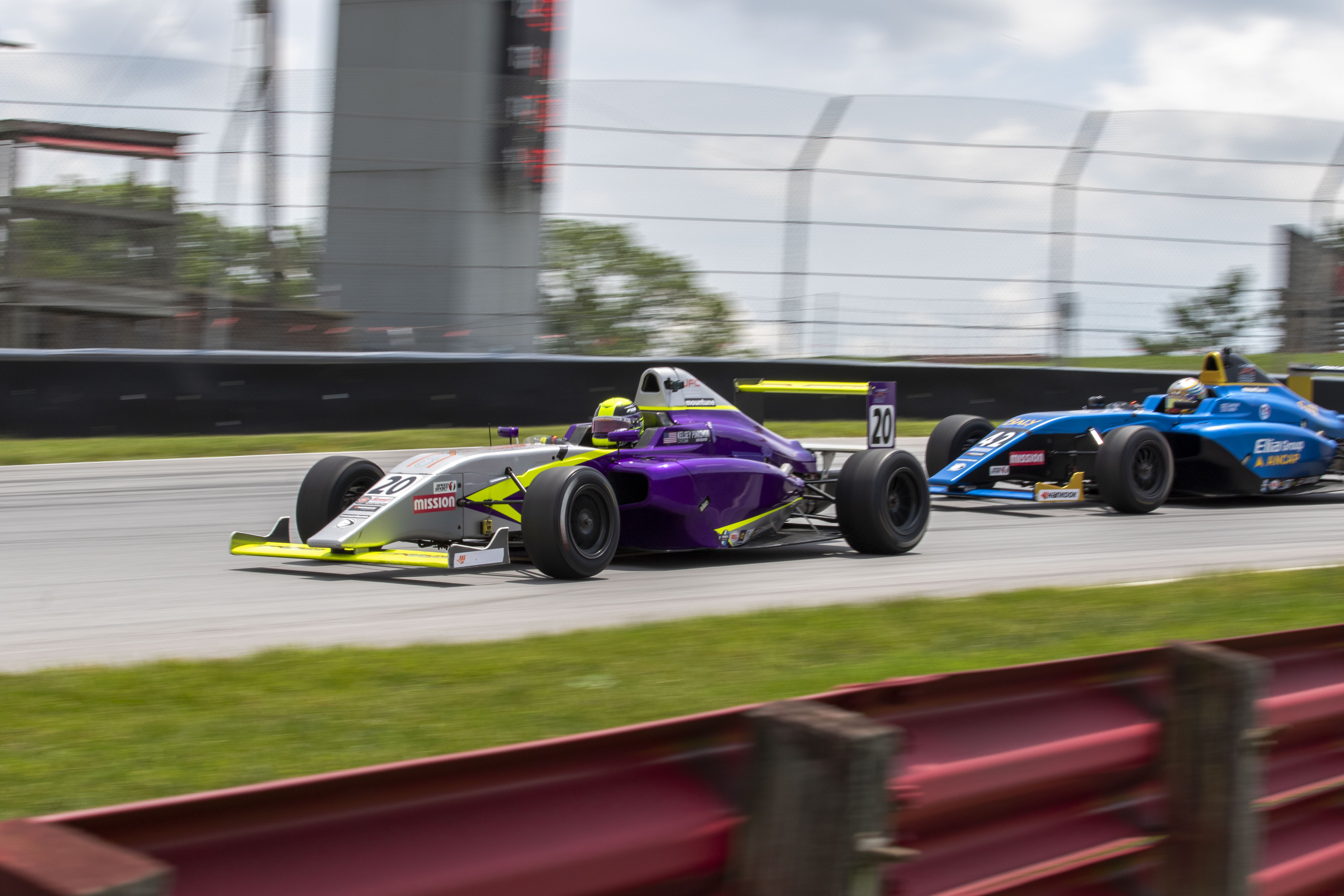 MX-5 cars race through the Mid-Ohio Sports Car Course