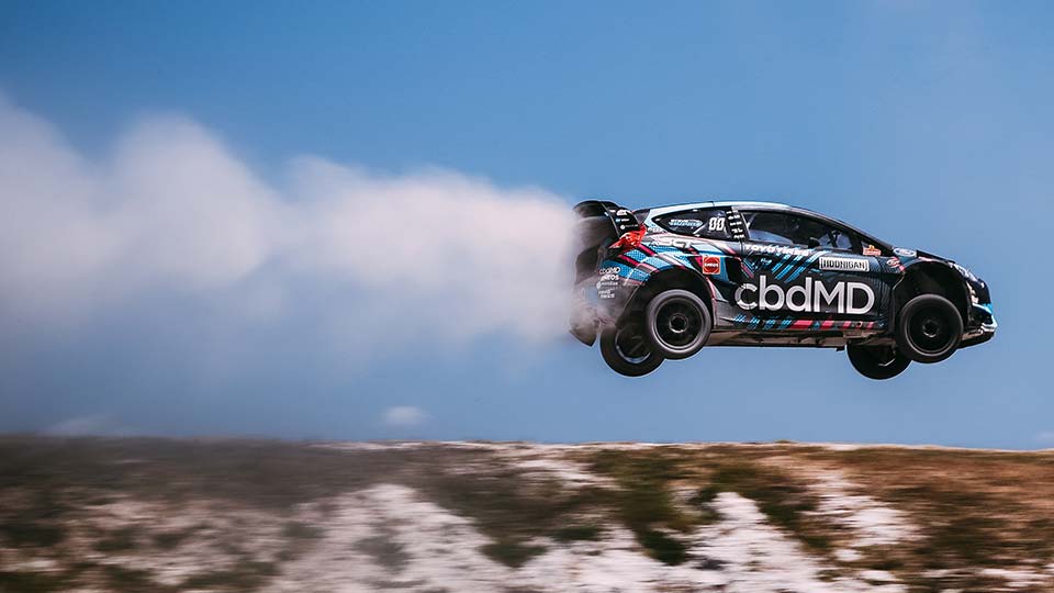Steve Arpin flies through the air in his RallyCross car
