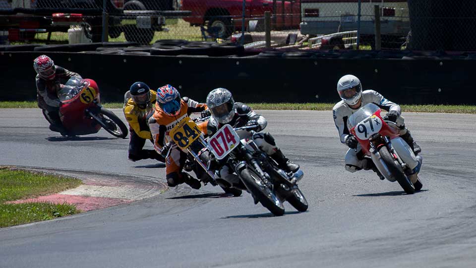 vintage motorcycles race around the Mid-Ohio Sports Car Course