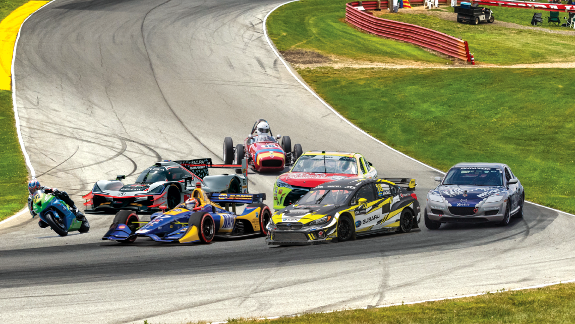 A variety of race cars and bikes on the Mid-Ohio Sports Car Course